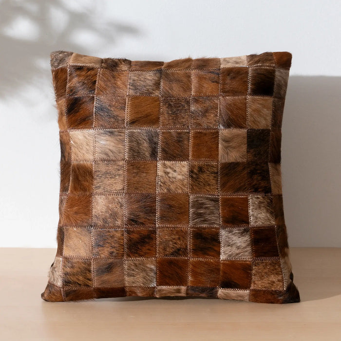 Patchwork cowhide pillow on a neutral background | Brindle Cowhide Patchwork Pillow | eCowhides