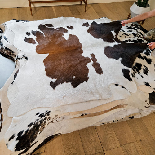 Brazilian Chocolate and White Cowhide Rug Size 5'6" L x 5'9" W 9376