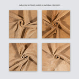 Beige cowhide rug, full view on hardwood floor