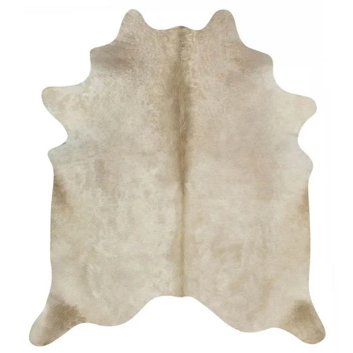 Beige cowhide rug on a white background