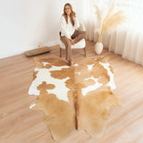 Palomino and white cowhide rug styled in a modern living room