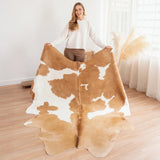 Palomino and white cowhide rug — warm golden-tan tone, natural hair-on Brazilian leather