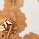 Close-up of palomino and white cowhide hair texture
