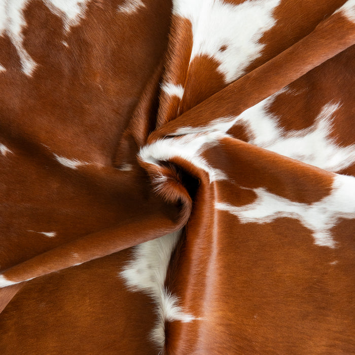 Brown and White Cowhide Rug