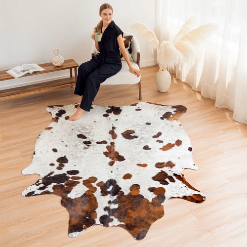 Close-up of white, brown and black cowhide hair texture on a white tricolor cowhide rug