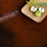 Close-up of mahogany cowhide hair texture, rich brown and black