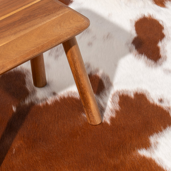 Brown and White Cowhide Rug