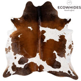 Chocolate and white cowhide rug — bold asymmetric pattern, natural hair-on Brazilian leather