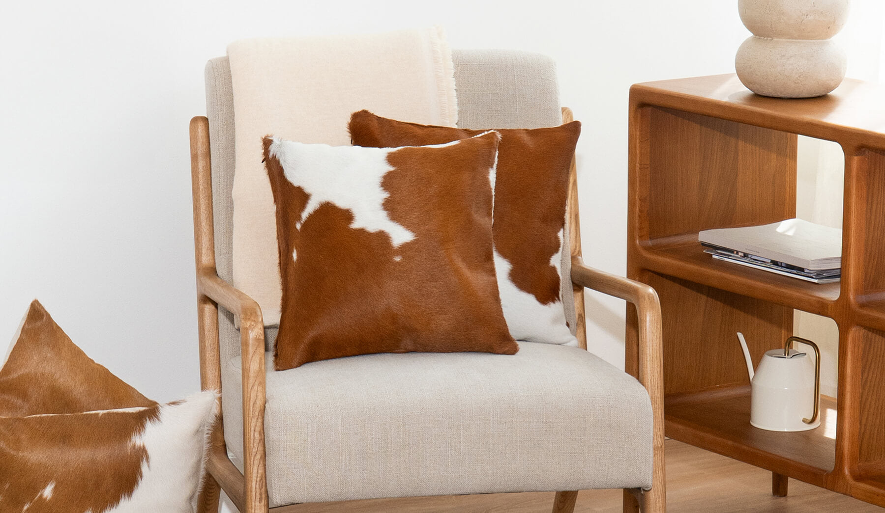 Brown and White Cowhide Pillow Lifestyle
