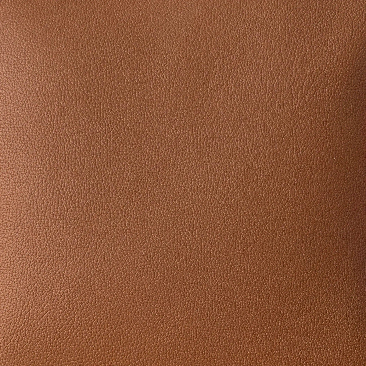 A close-up of a brown pebbled leather