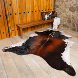 Close-up of chocolate brown and white cowhide hair texture