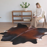 Mahogany cowhide rug thumbnail — close-up of natural color depth
