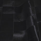 Rhodes black patchwork cowhide rug thumbnail — close-up of square pattern