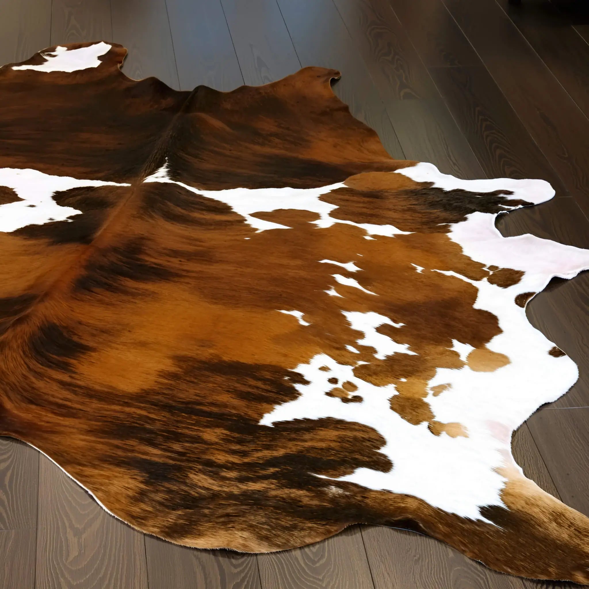 Tricolor cowhide rug — brown, black and white, natural hair-on hide
