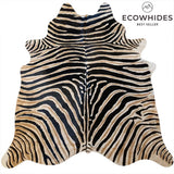 Zebra safari cowhide rug — hand-printed black and brown stripes on genuine Brazilian cowhide