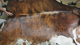 Brindle white belly cowhide rug flipping